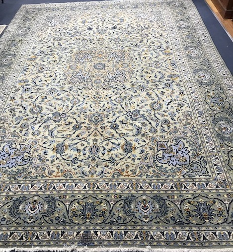 A Persian cream gorund carpet 400 x 300cm
